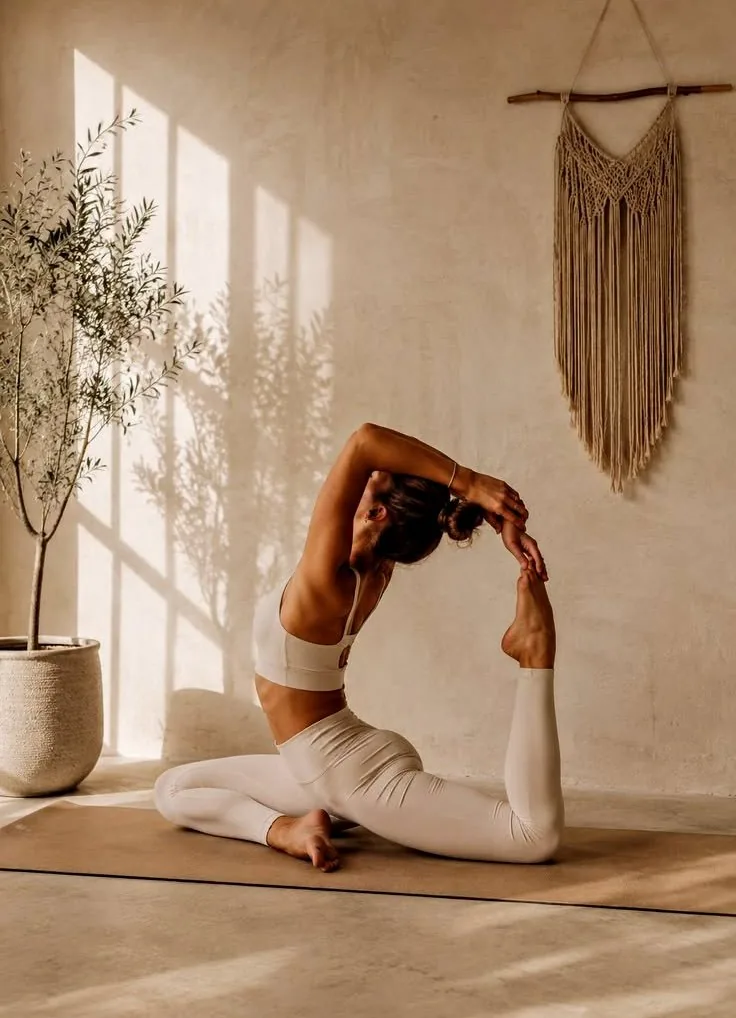 A woman practising yoga in a sunlit room